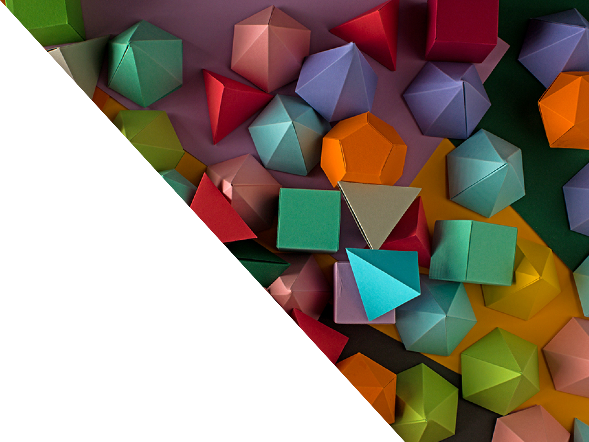 Colorful abstract geometric background with three-dimensional solid figures  Pyramid Dodecahedron prism rectangular cube arranged on colored paper 