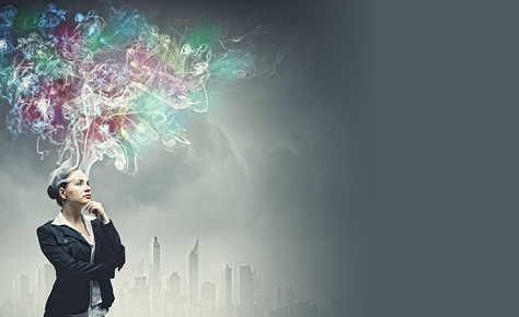 Thoughtful businesswoman with colorful fumes above head