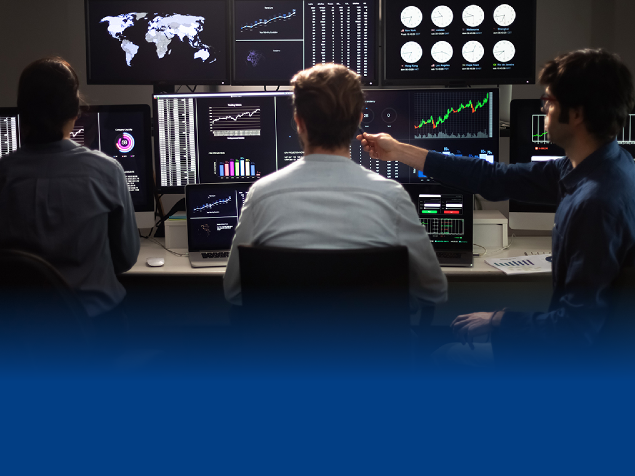 Team of financial analysts working in the office. Stock market and trading concept.